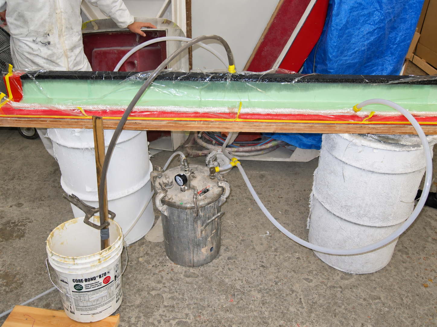 Vacuum infusion bag and resin lines on a part
